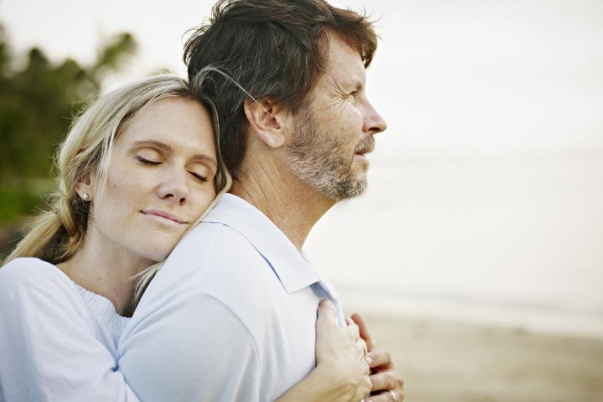 Woman hugging man