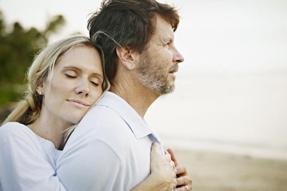 Woman hugging man