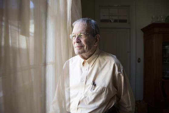 Man looking out the window